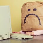 sad sack at a computer